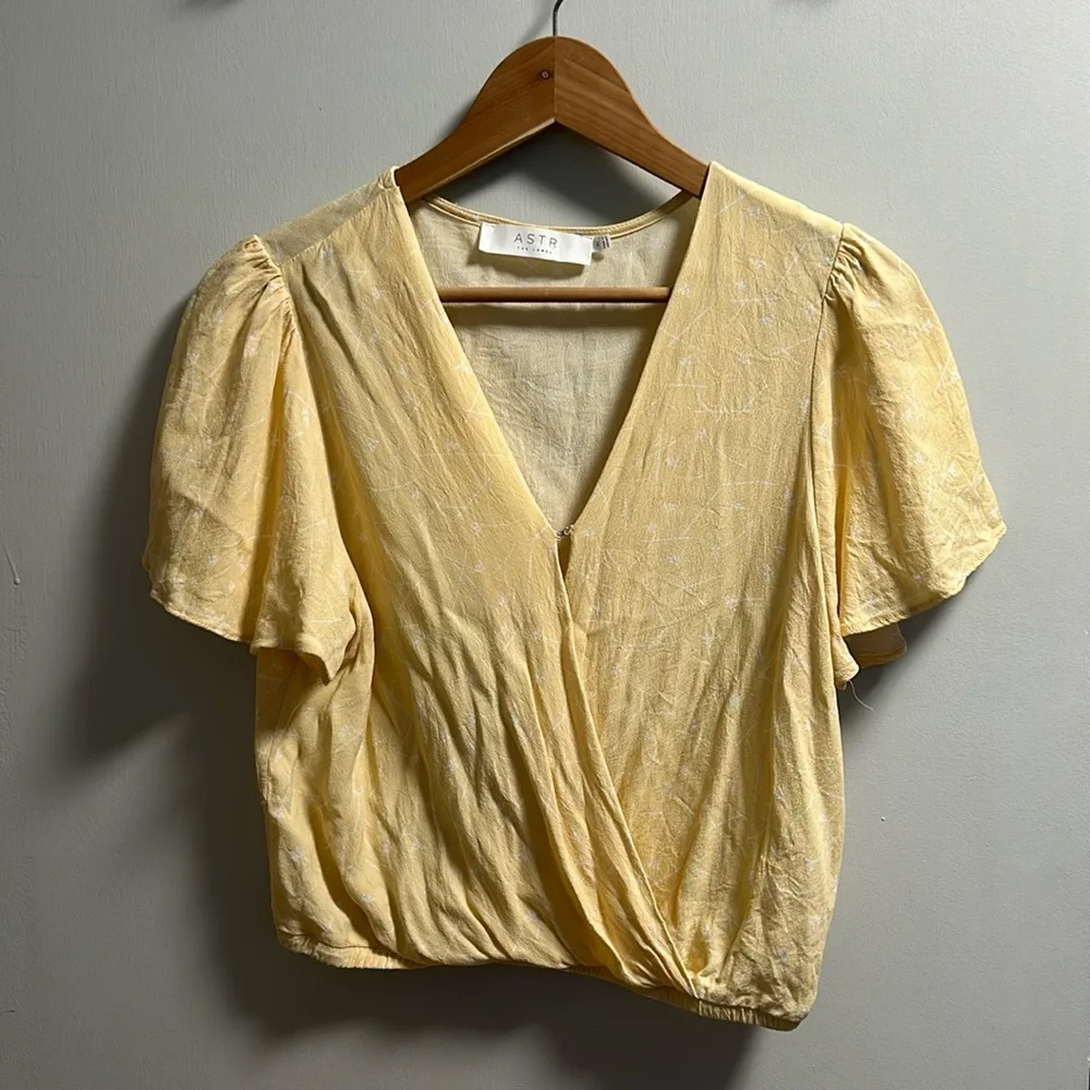 Pastel yellow with delicate white floral print. Flowy sleeves. Cropped. - Picture 1 of 3